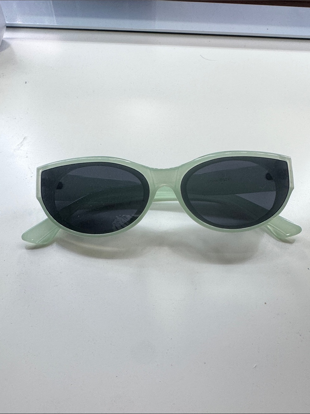 Translucent Mint Cat-Eye Sunglasses with Dark Lenses